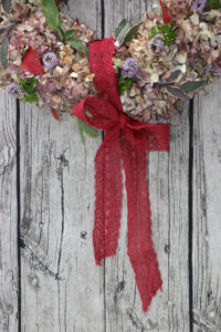 Door wreath made of hydrangeas and colored leaves Door wreath made of hydrangeas and colored leaves